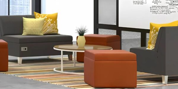 A modern office featuring a couch, ottoman, and coffee table, designed to enhance meeting room productivity.