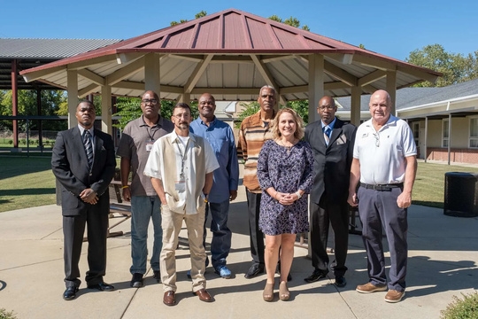 Jimmie Hale Mission community group under an outdoor pavilion