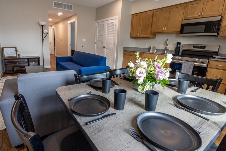 Furnished apartment kitchen and living area at Rothstein Village